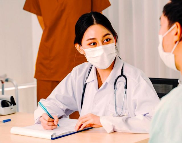 Photo of doctor talking about Thai company FWD Group's insurance policy. FWD Group successfully ran Facebook Messenger ads.