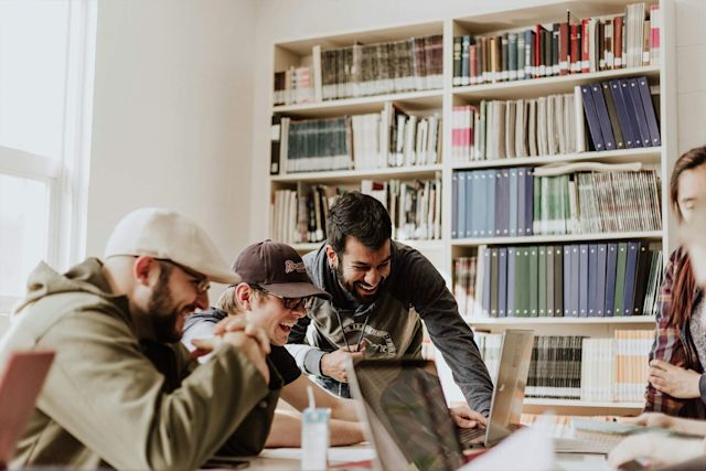 university students studying in a library