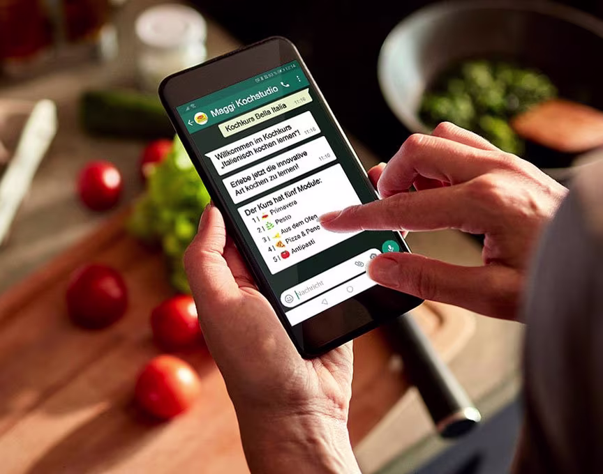 Woman holding a phone interacting with Maggi's WhatsApp marketing campaign.